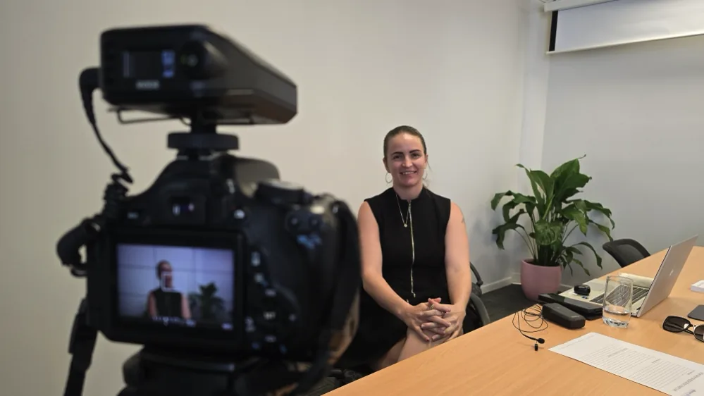 A training video being filmed in a boardroom