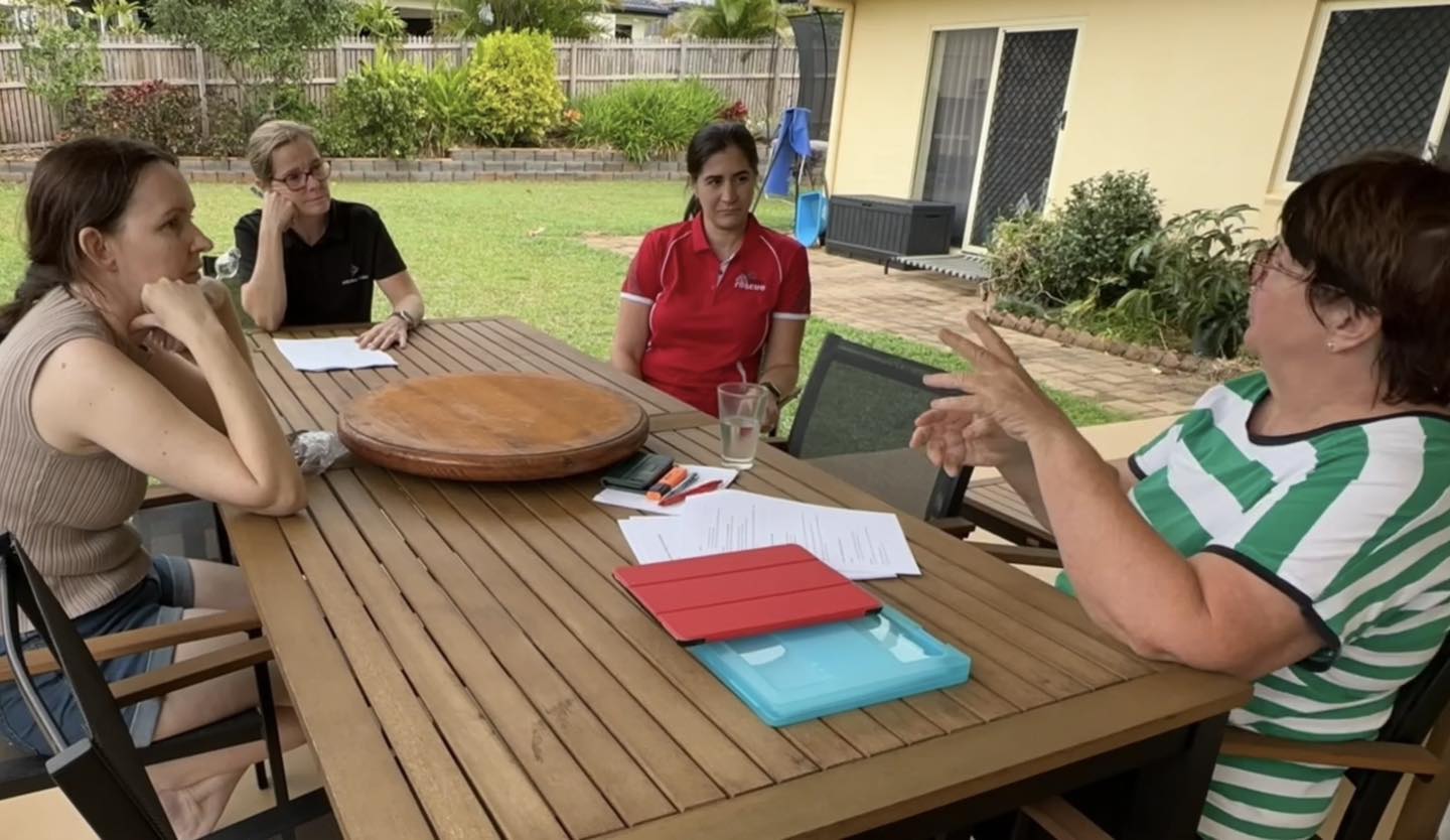 The NQAR team gathered around, planning their next video together